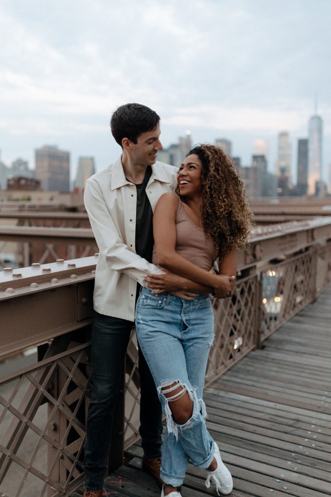 Elope in New York City l Couple standing on the Brooklyn Bridge at sunrise
